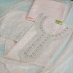 Elegant Peach Georgette Schiffli Suit with Intricate Embroidered Neckline