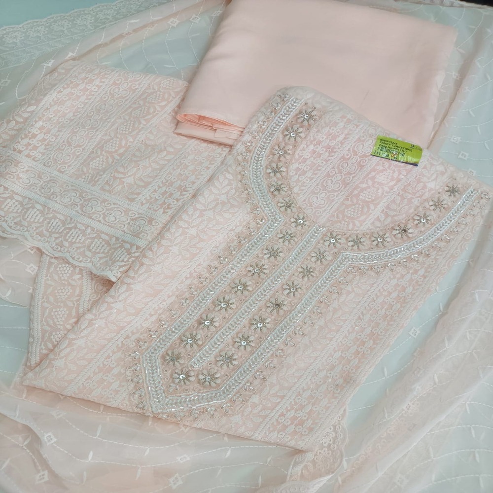 WhatsApp Image 2026-04-12 at 11.30.15 PM Elegant Peach Georgette Schiffli Suit with Intricate Embroidered Neckline - Image 1